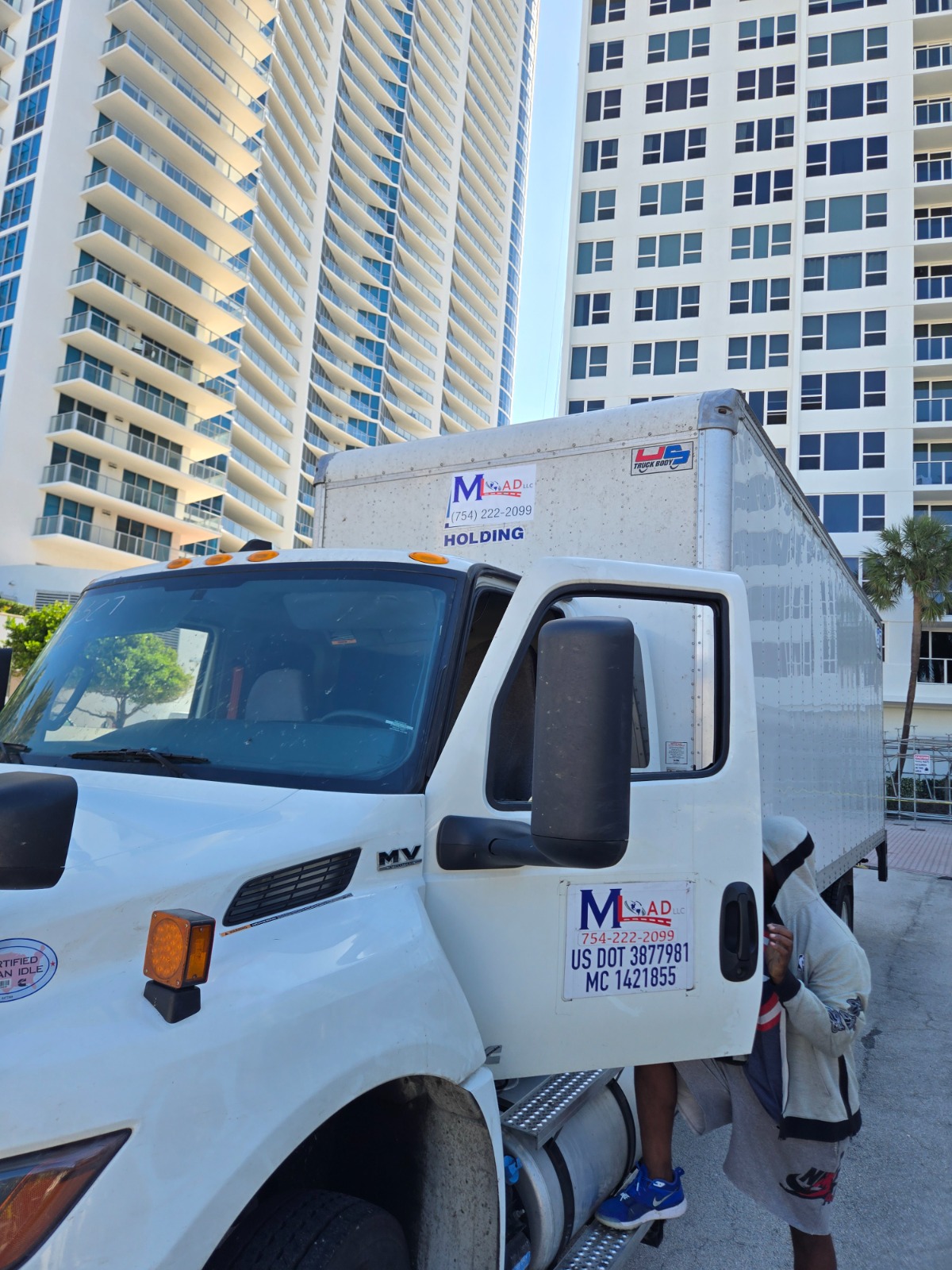 Mload truck on a city high-rise delivery